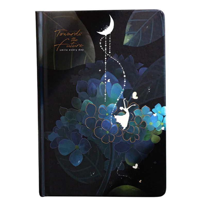 A5 size notebook with a luminous reflective cover, open to show internal pages with colour illustrations.