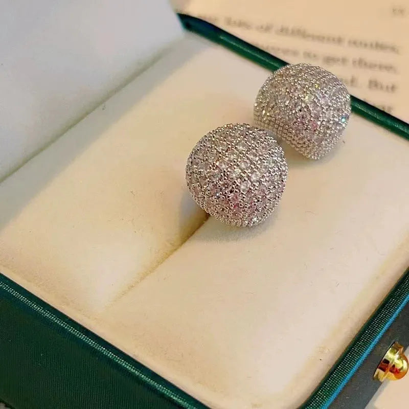 Geometric drop earrings with full diamond pave on golden spherical components in gold and white colour options