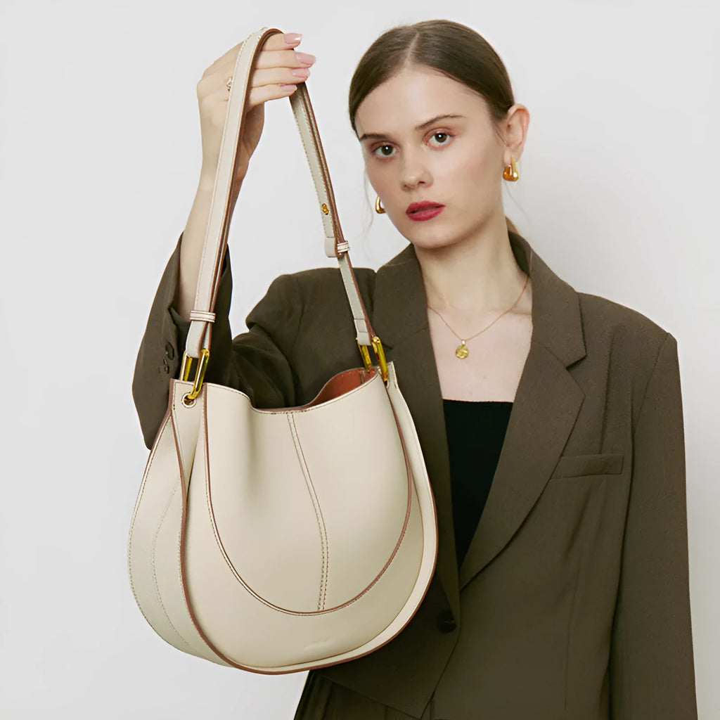Designer small crossbody bag for women, genuine leather, round shape, retro splicing, milkshake white colour