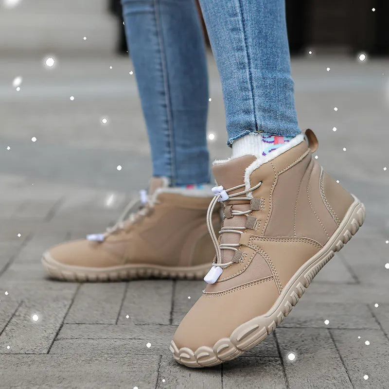 Black waterproof snow boots with fleece lining and a lace-up front on a rubber sole.