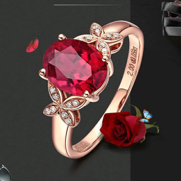 Women's copper butterfly ring with heart shape and rose gold finish showing red gemstone accent option