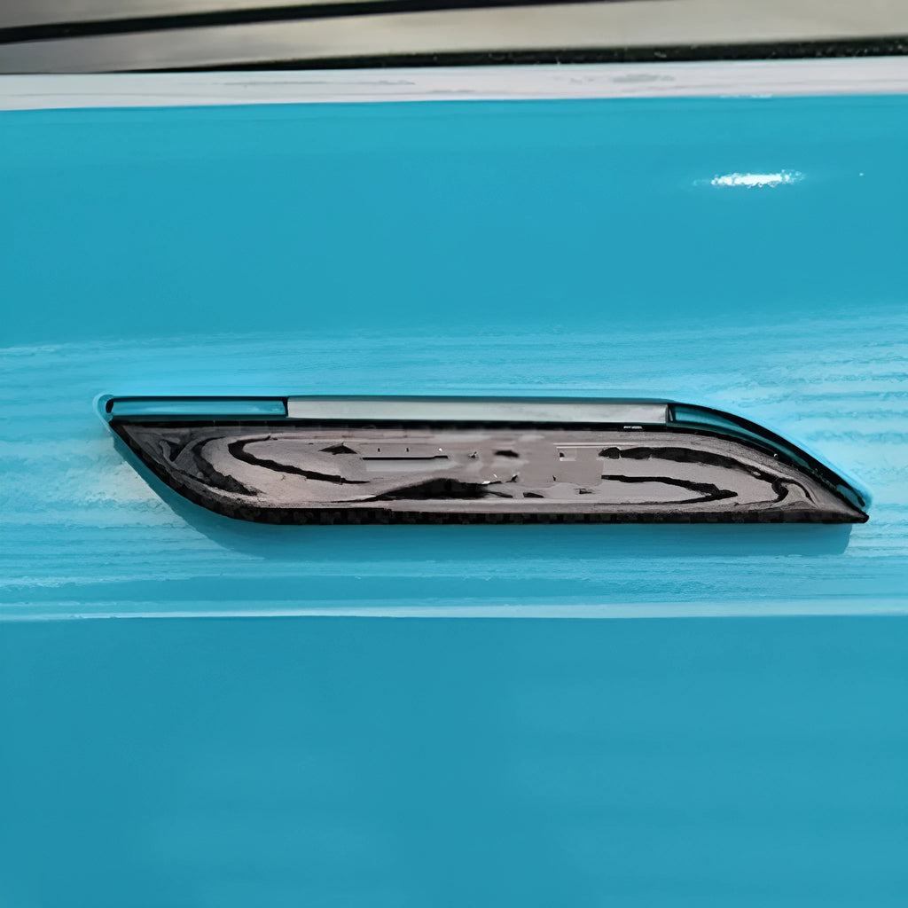 Four clear carbon fibre adhesive door handle protection patches for Tesla Model S interior.
