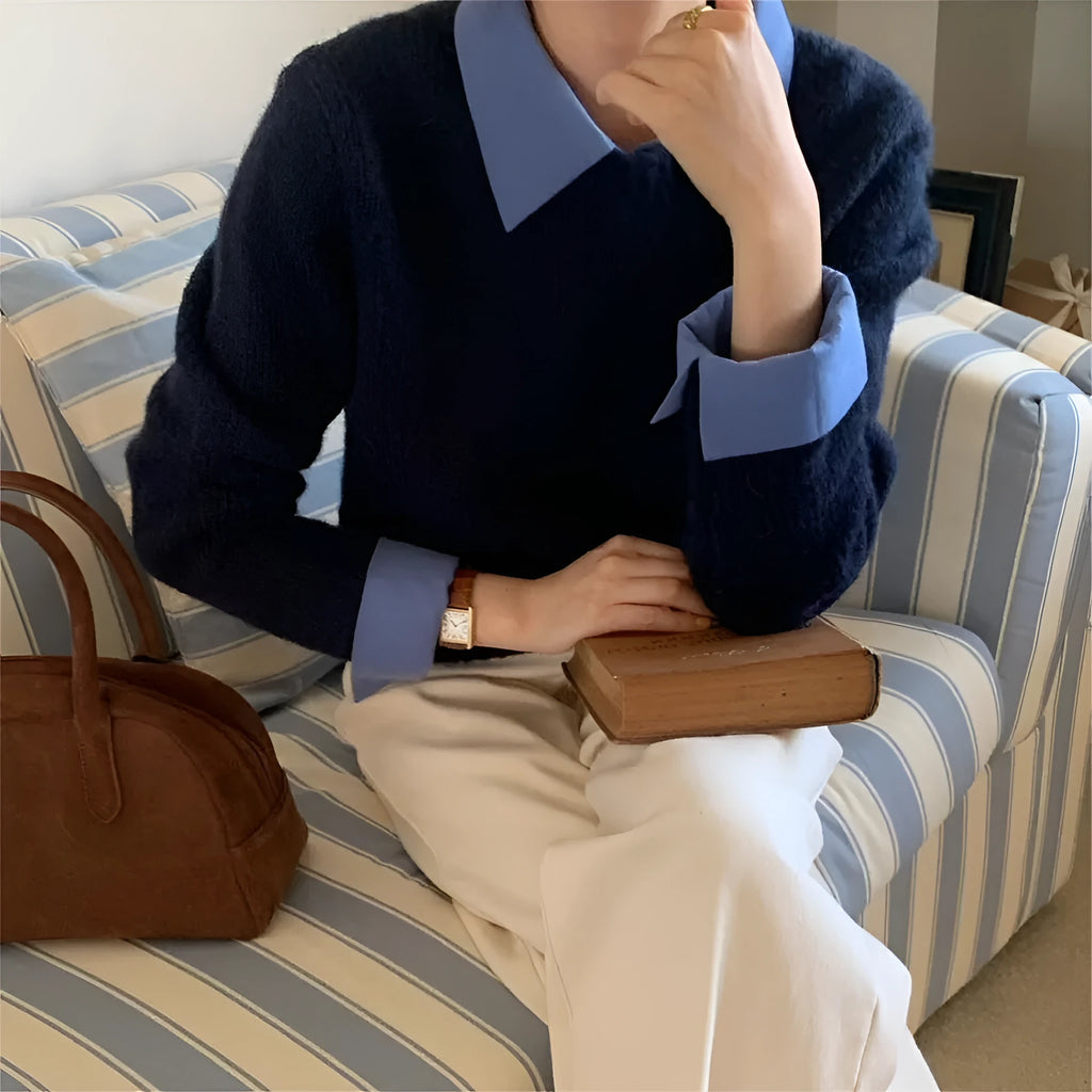 Women's loose fit knitted top with contrast colour lapels in navy blue.