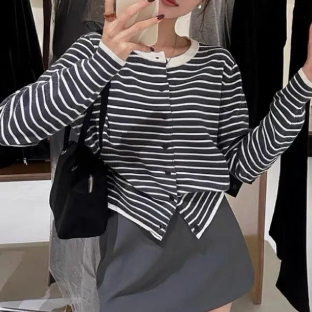Dark grey and white striped women's slim-fit cardigan coat with long sleeves, shown on a model.