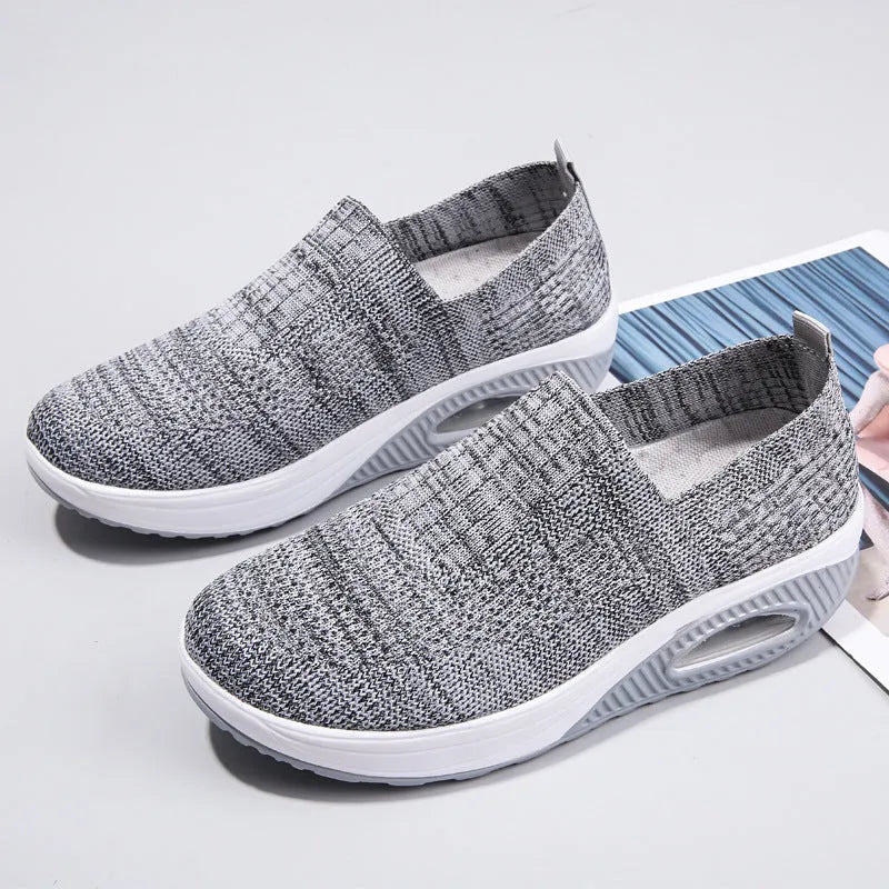 Women's mesh running shoes with air cushion midsole in beige colour showing round toe design