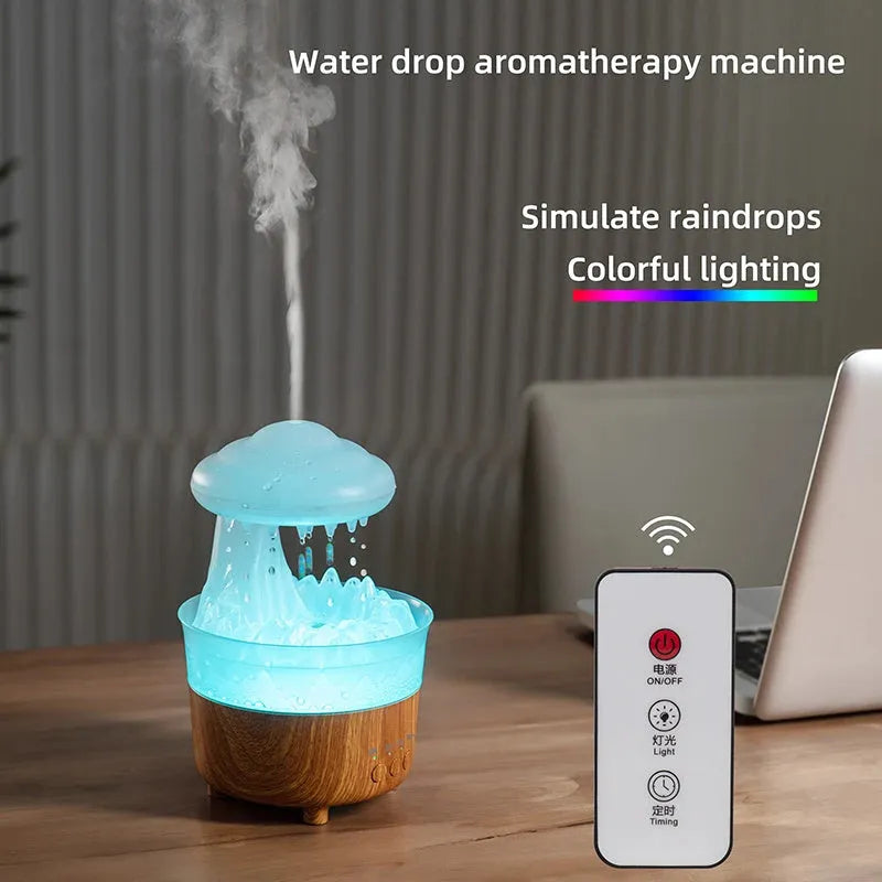 Wood grain white cloud-shaped humidifier diffuser with LED lights and water drop rain effect on a table.