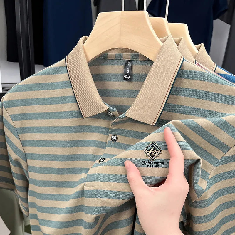Man wearing a red and blue striped short sleeve casual shirt with a mosaic pattern.