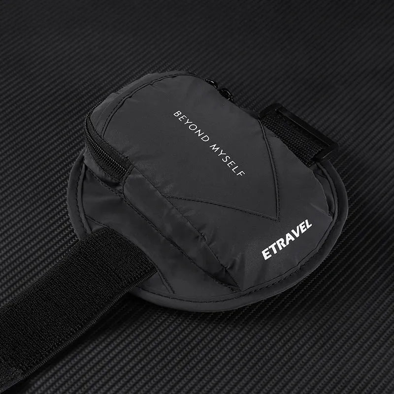 Black reflective running arm bag with adjustable strap, shown on an arm.