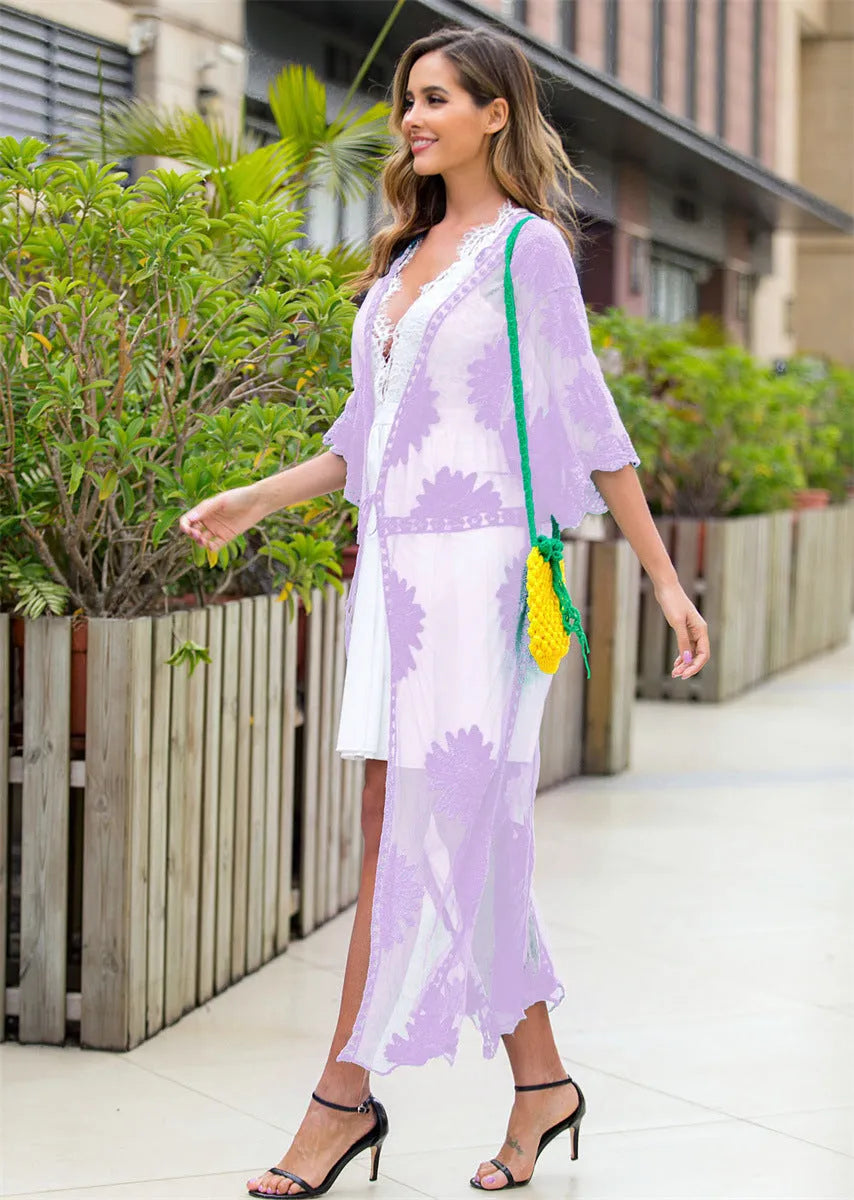 Light purple women's beach dress with lace embroidery, worn as a swimsuit cover-up.