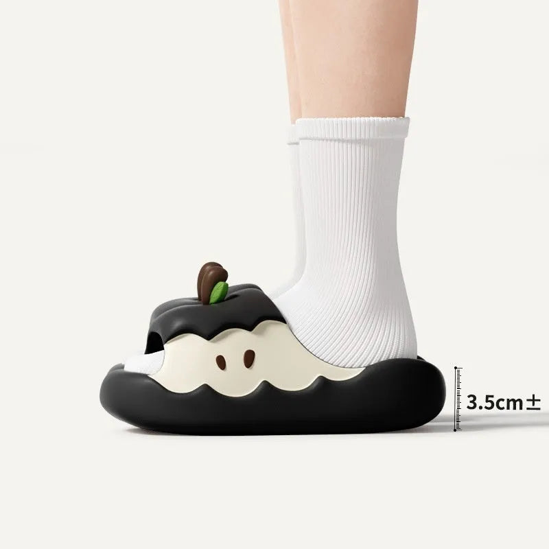 Pair of fruit-themed cartoon EVA flip flop sandals for parent-child home wear on a light background.