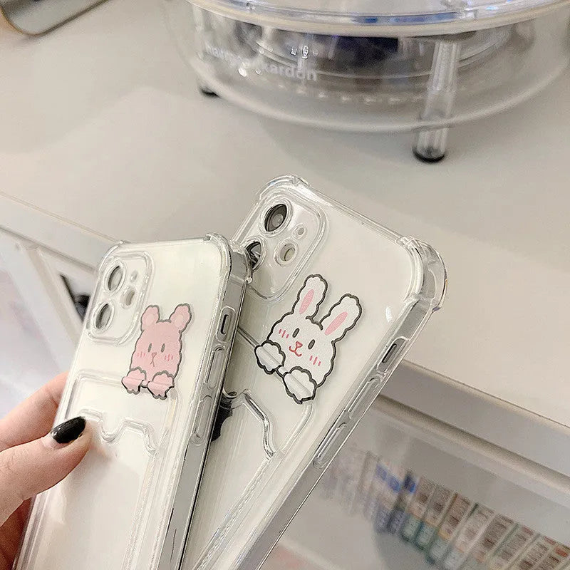 Transparent cartoon iPhone case with a built-in card holder slot.
