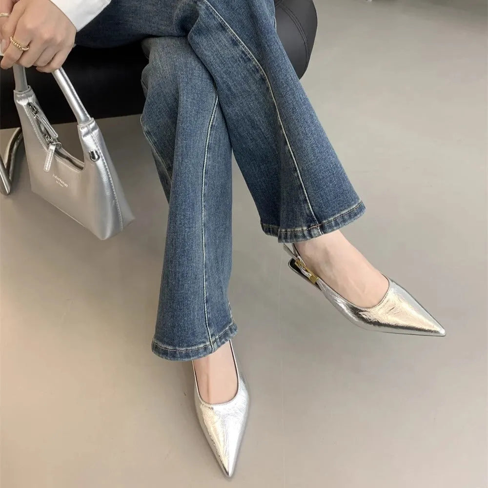 Thin low heel strap pointed leather shoes in black, red, brown, or silver on a rubber sole.