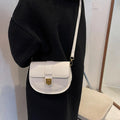 French one shoulder saddle bag for women with lock and stone pattern, available in beige