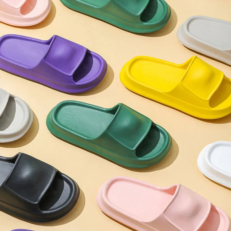 Soft EVA flip-flop slippers in multiple colours on a white background, showing thick sole and non-slip pattern.