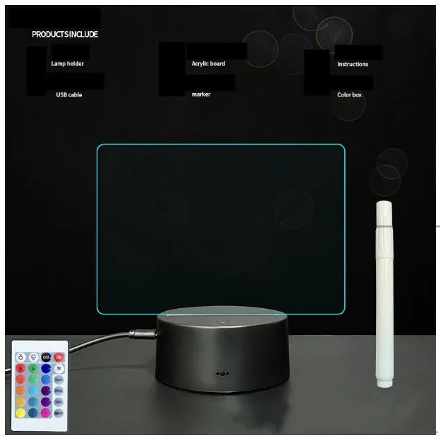 3D acrylic message board night light with remote control and stylus on a desk.
