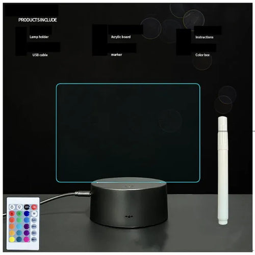 3D acrylic message board night light with remote control and stylus on a desk.