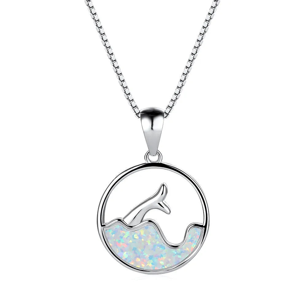 Geometric fishtail pendant necklace with a round blue opal on a silver-toned chain.
