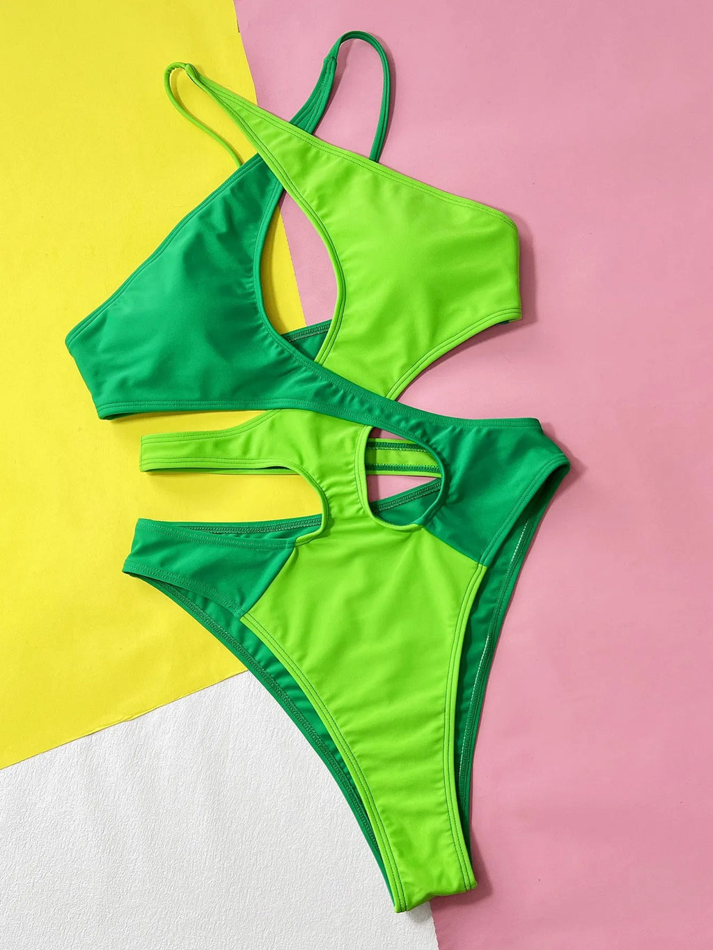 Green women's one-piece swimsuit with hollow contrast colour design in nylon fabric
