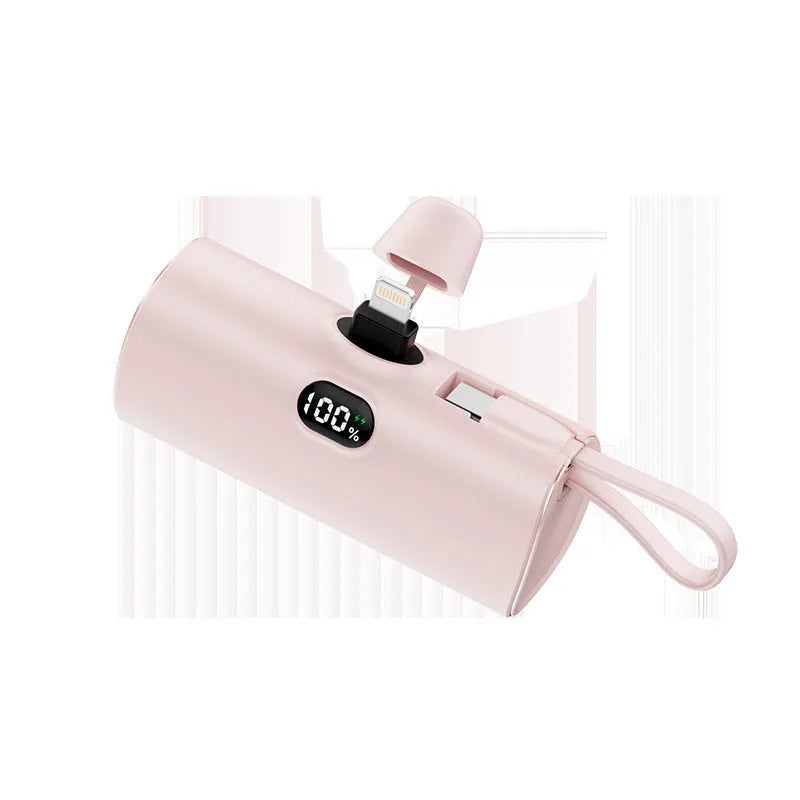 Compact capsule‑shaped digital display power bank with integrated plug, shown in multiple colours.