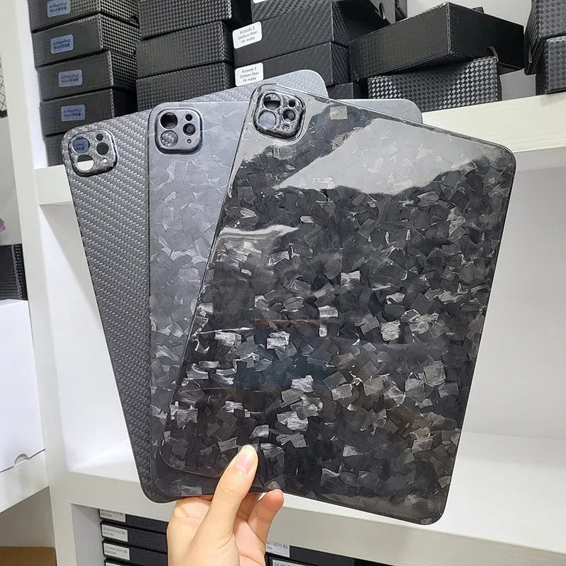 Genuine carbon fibre hard protective case for Apple iPad Pro 11 on a table.