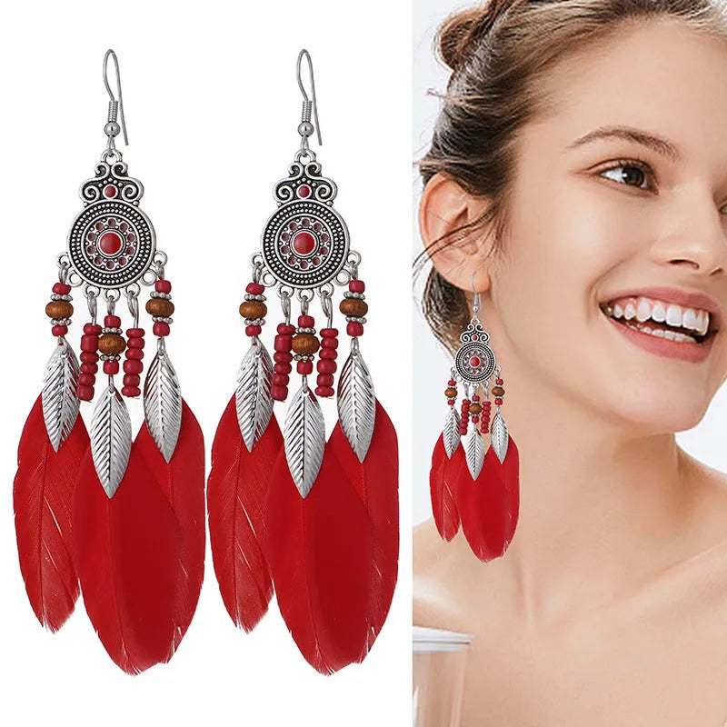 Round drop feather earrings with leaf design in bohemian style available in thirteen different colours