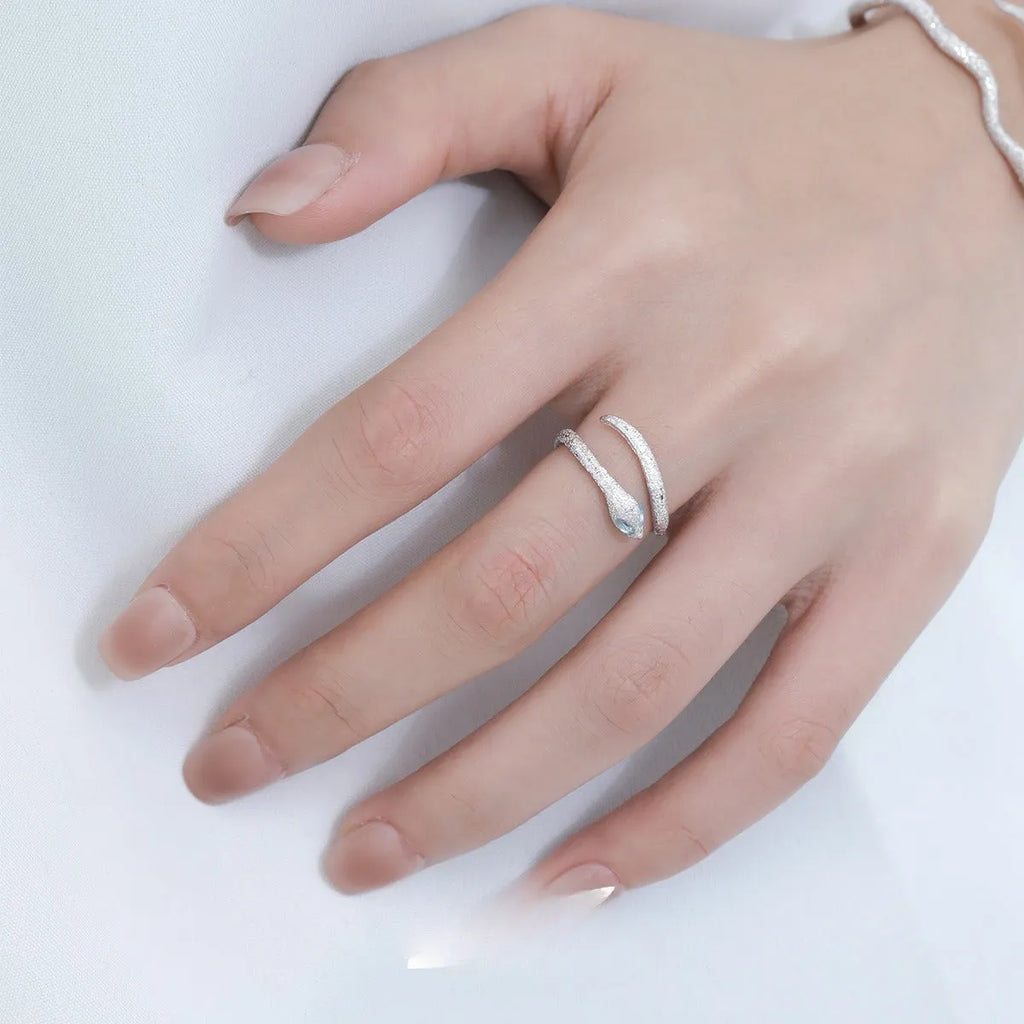 Women's adjustable silver snake zodiac ring in platinum colour.