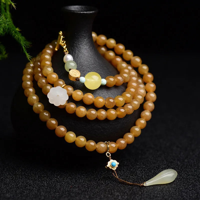 Women's water green pine jade bracelet with 6mm round beads and leaf-shaped sequin details.