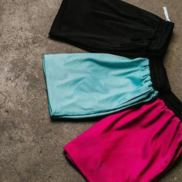 Men's solid-colour mesh quick-drying shorts for running in summer, shown in multiple colour options.