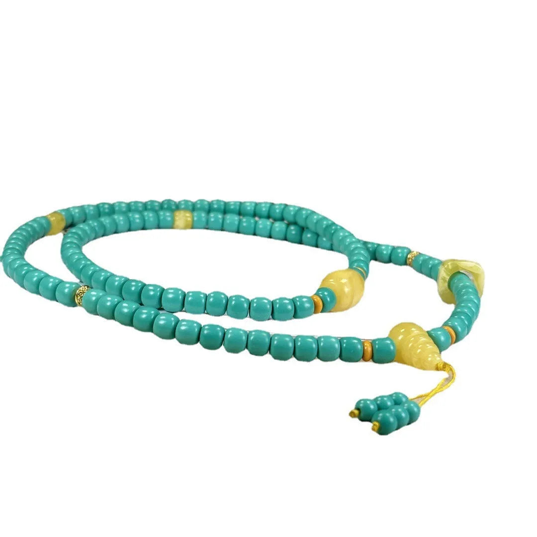 Turquoise mesh flower lucky pendant necklace on an adjustable ball bead chain.