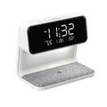 White 3-in-1 bedside table lamp with wireless charging pad, LCD screen, and touch dimmer.