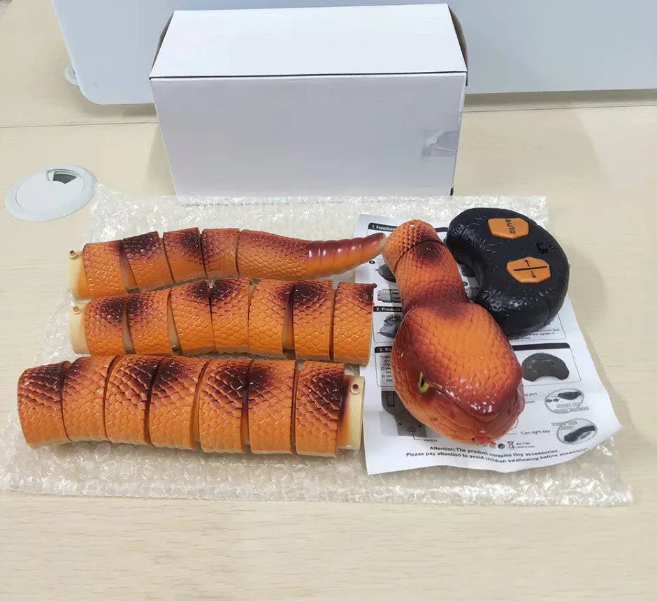 Smart sensing electronic snake cat toy with segmented plastic body and built-in catnip compartment