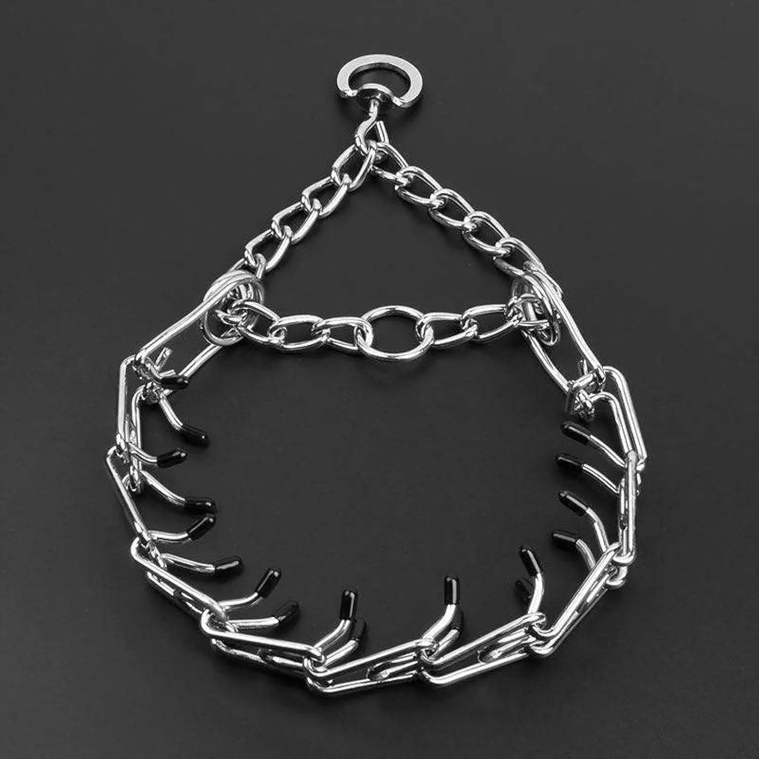 Stainless steel dog prong collar with adjustable chain links and black rubber comfort tips, laid flat to show sizing.