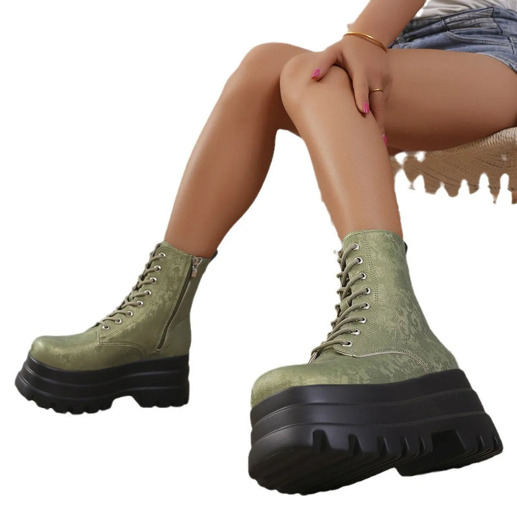 Women's black retro platform Martin boots with chunky heel and side zipper detail.