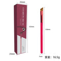 Black angled square eyebrow stamp brush with synthetic bristles on a wooden table