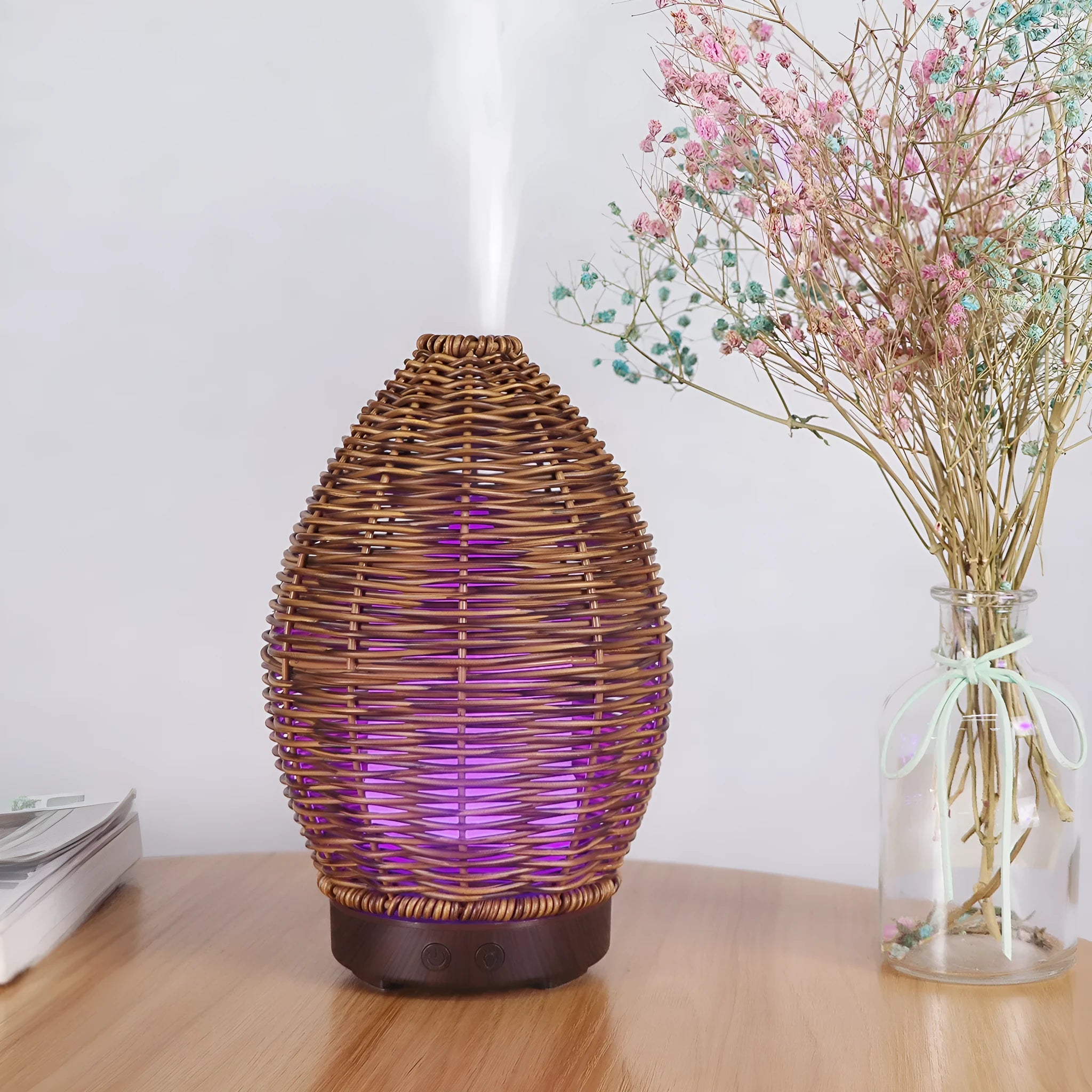 Hollow rattan aroma diffuser with light wood grain base showing 100ml capacity ultrasonic unit