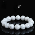 Geometric natural blizzard snowflake crystal women's bracelet with round beads on a white background.