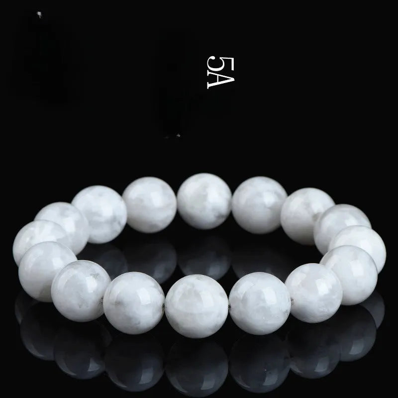 Geometric natural blizzard snowflake crystal women's bracelet with round beads on a white background.