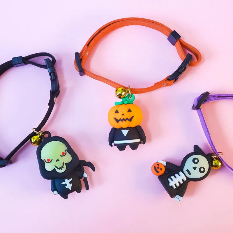 Halloween pet collar with cartoon pumpkin and skull patterns in glow-in-the-dark material, shown in multiple sizes.