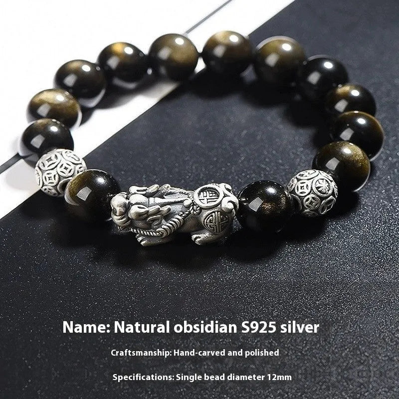 Men's sterling silver and obsidian bracelet with geometric design on a brown leather band.