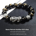 Men's sterling silver and obsidian bracelet with geometric design on a brown leather band.