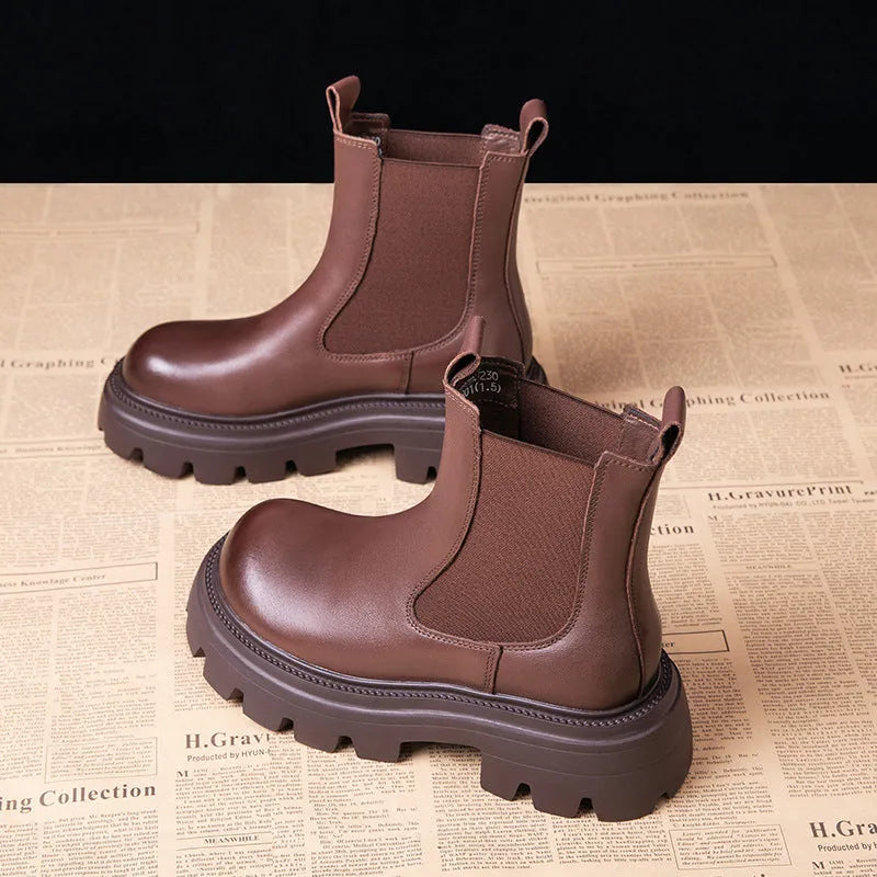 Women's brown brushed cowhide Martin boots with high horseshoe heel, round toe, and thick rubber sole