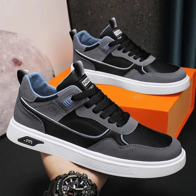 Men's solid colour canvas board shoes with leather stitching and a low-top design.
