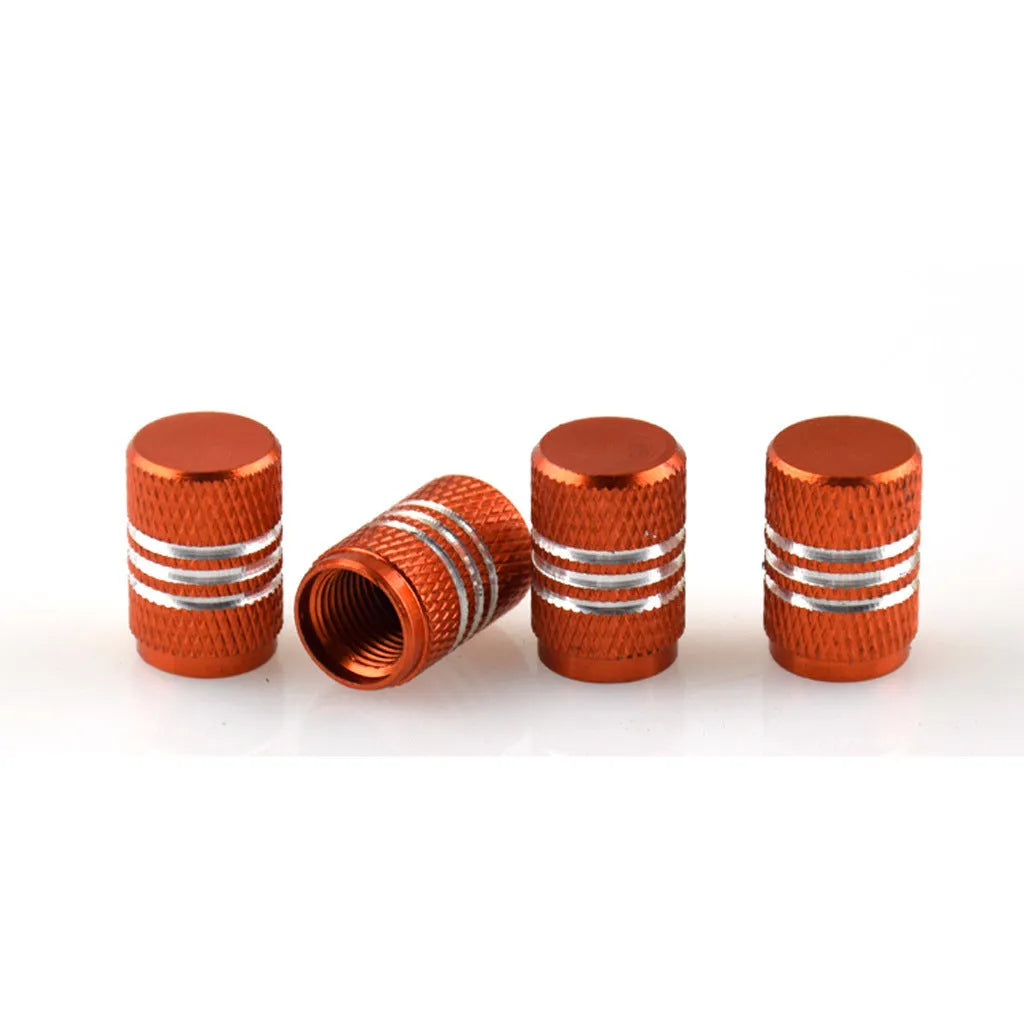 Set of stainless steel car tyre valve caps in multiple colours including red, blue, black, and silver.