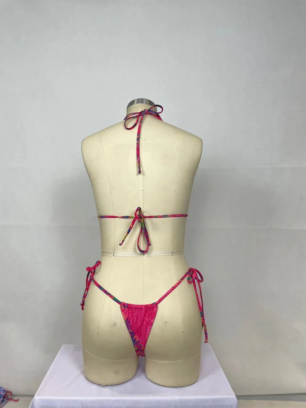 Pink printed women's bikini two-piece set with sleeveless design for swimming and water activities