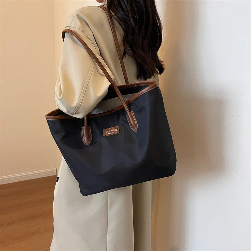 Large capacity women's shoulder bag in black oxford cloth with double straps and hidden pocket, vertical square shape