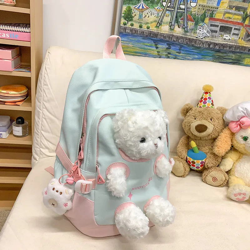 Nylon school backpack in a macaron colour with curved shoulder straps and sewing line detail.