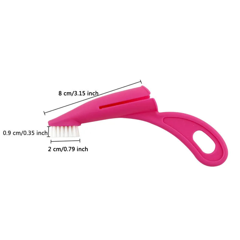 Red and white pet finger toothbrush with silicone bristles shown next to a ruler for scale.