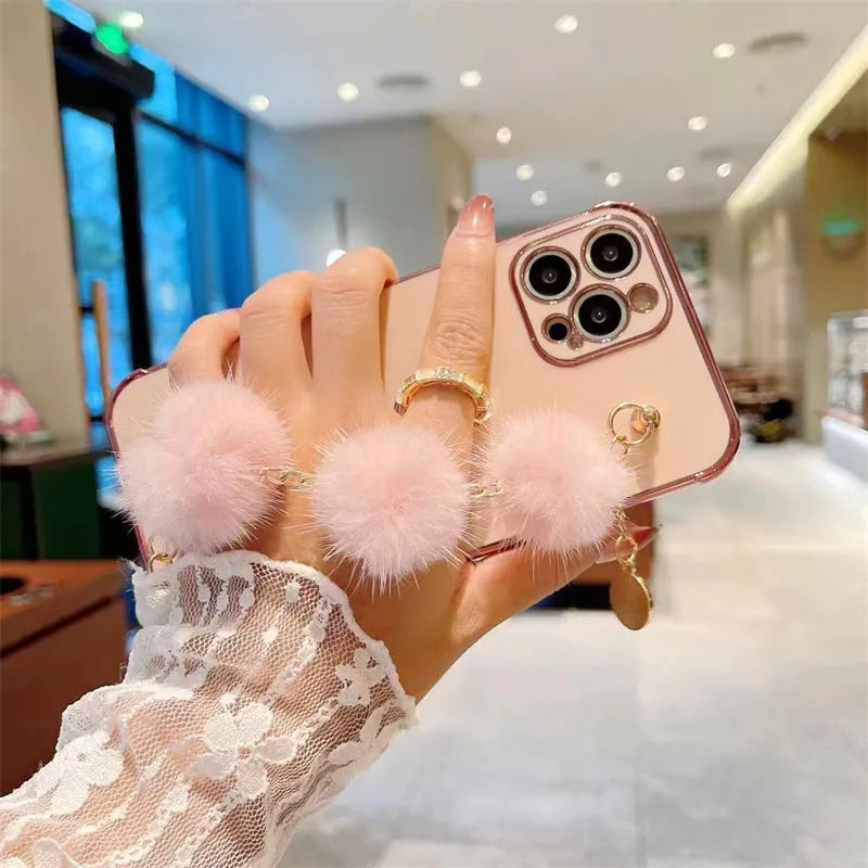 Plush bracelet iPhone case with side love design and holder in black, pink, purple, or white.
