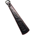 Leather hand massage racket with stainless steel panel, 25.5cm long, 142g, in black or brown