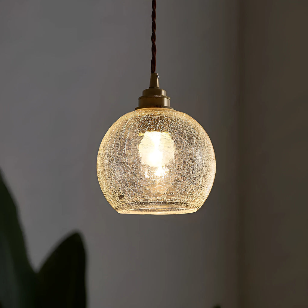 Retro brass ceiling chandelier with a clear glass ball shade, showing copper construction.